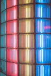 a close up of a multi colored glass block wall