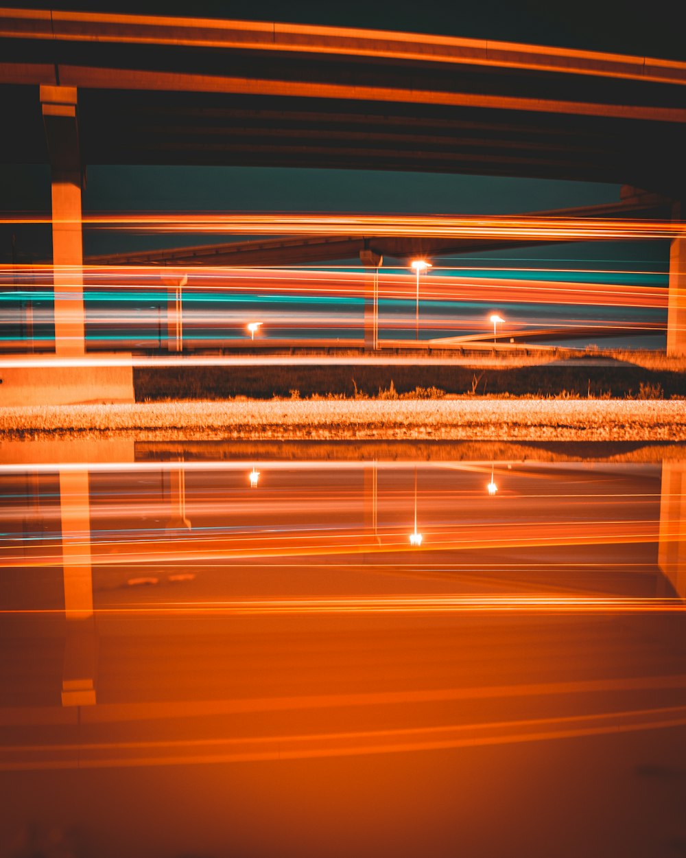 a blurry photo of a bridge and street lights