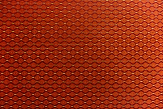 A close-up of the o'sullivan tartan fabric with the 'O' compass emblem subtly embroidered, symbolizing heritage and direction.