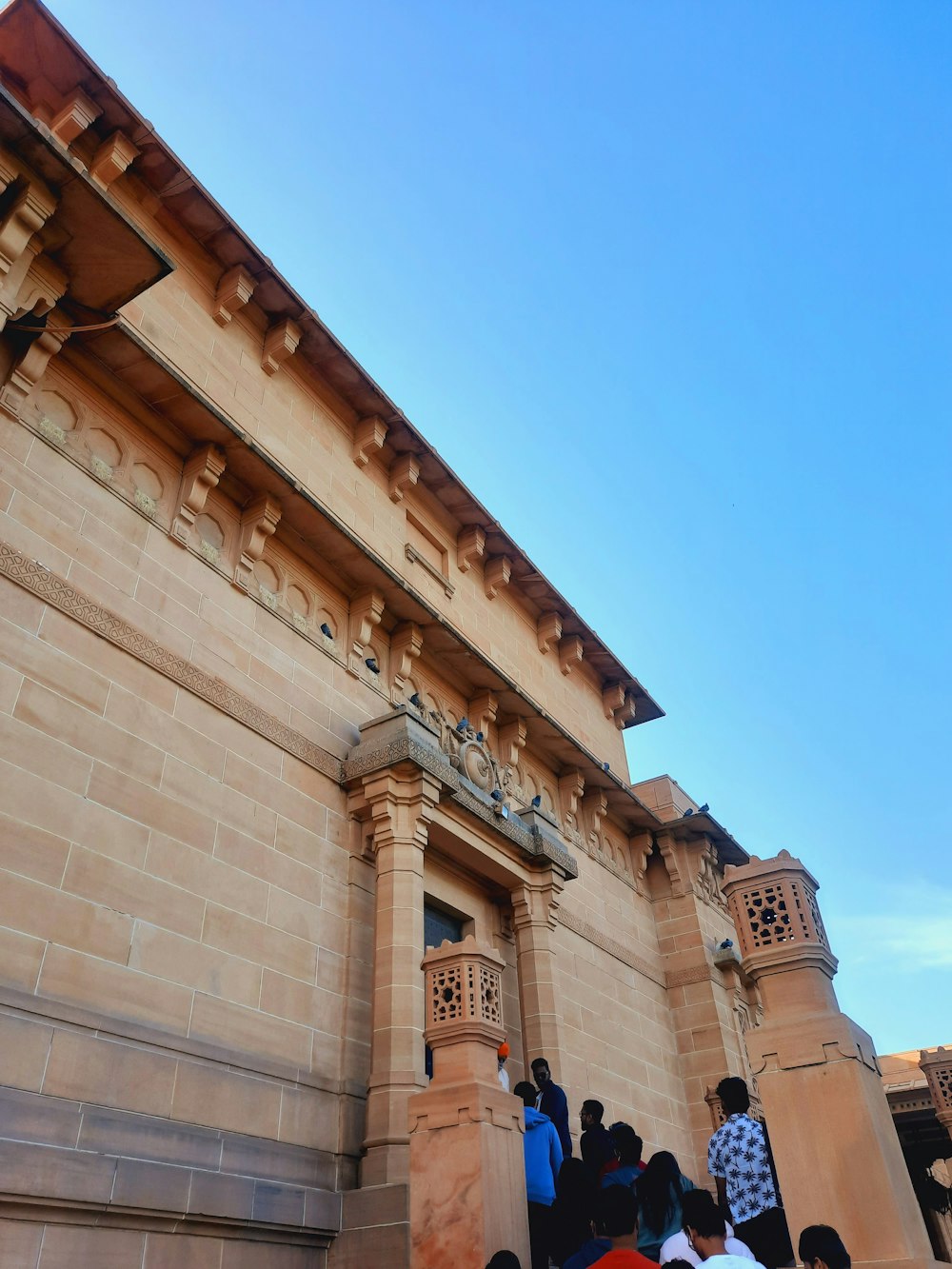 a group of people standing outside of a building