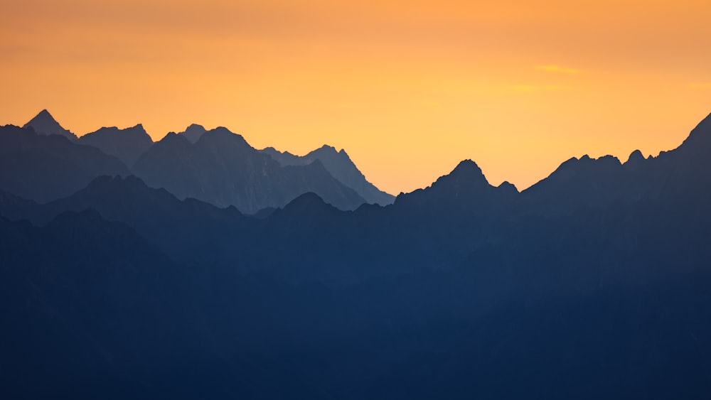 a view of a mountain range at sunset