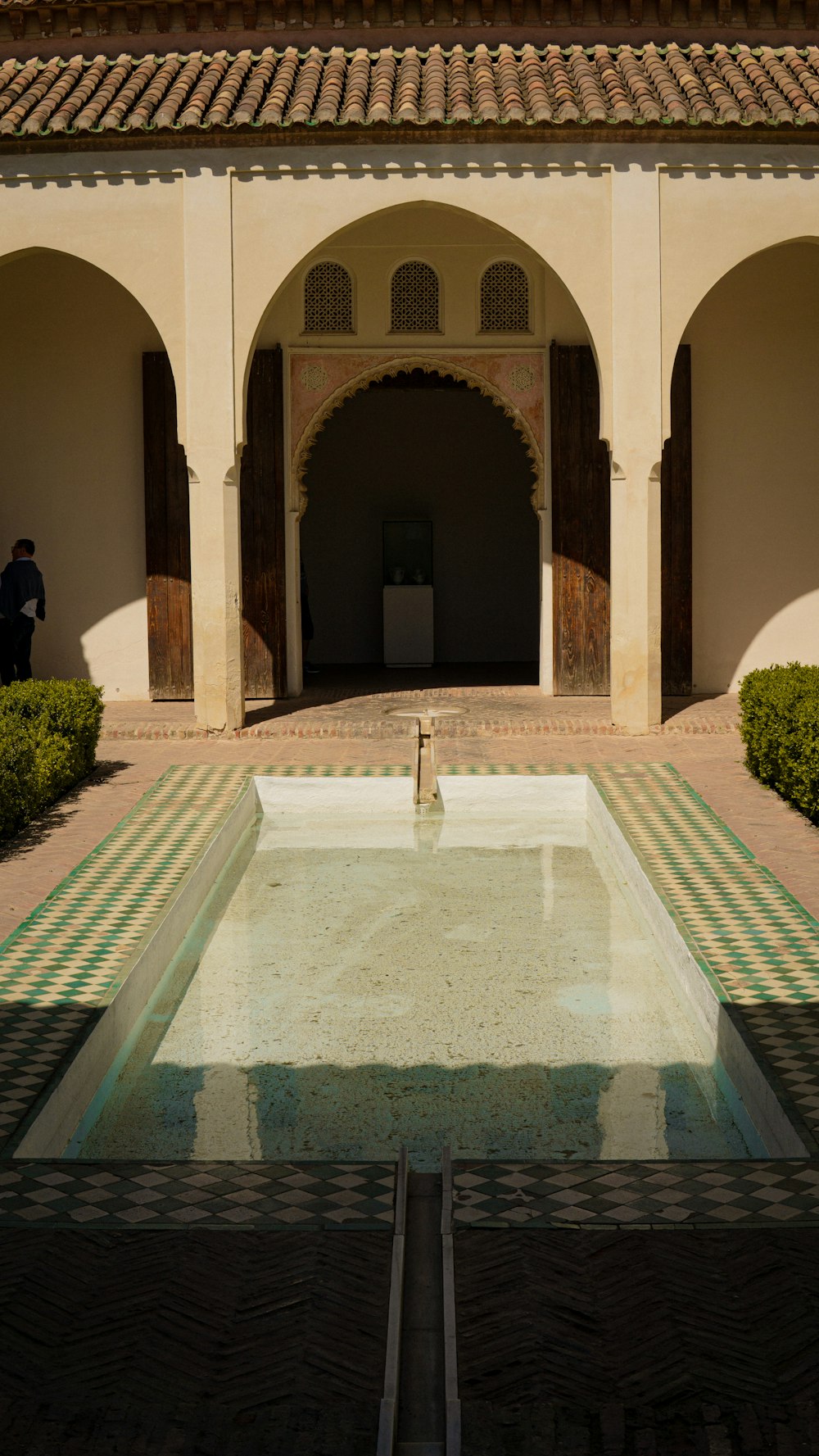 a pool in the middle of a courtyard