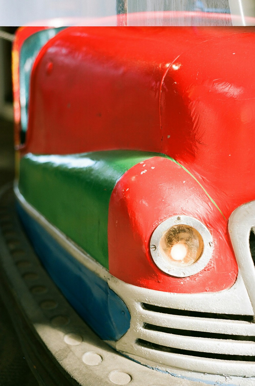 a close up of a red and green car