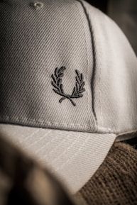 Close-up of a Valletta F.C. cap embroidered with the club's emblem.