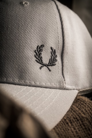 Close-up of a Valletta F.C. cap embroidered with the club's emblem.