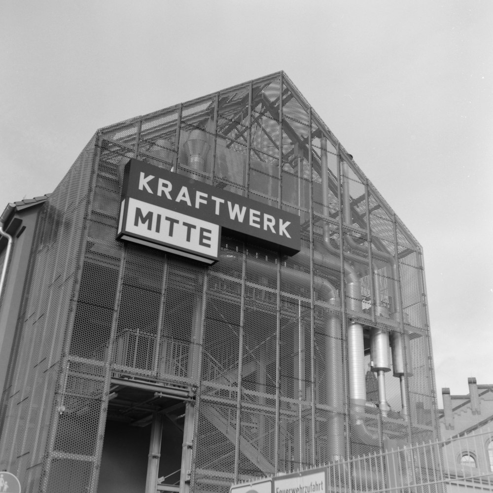 a black and white photo of a building under construction