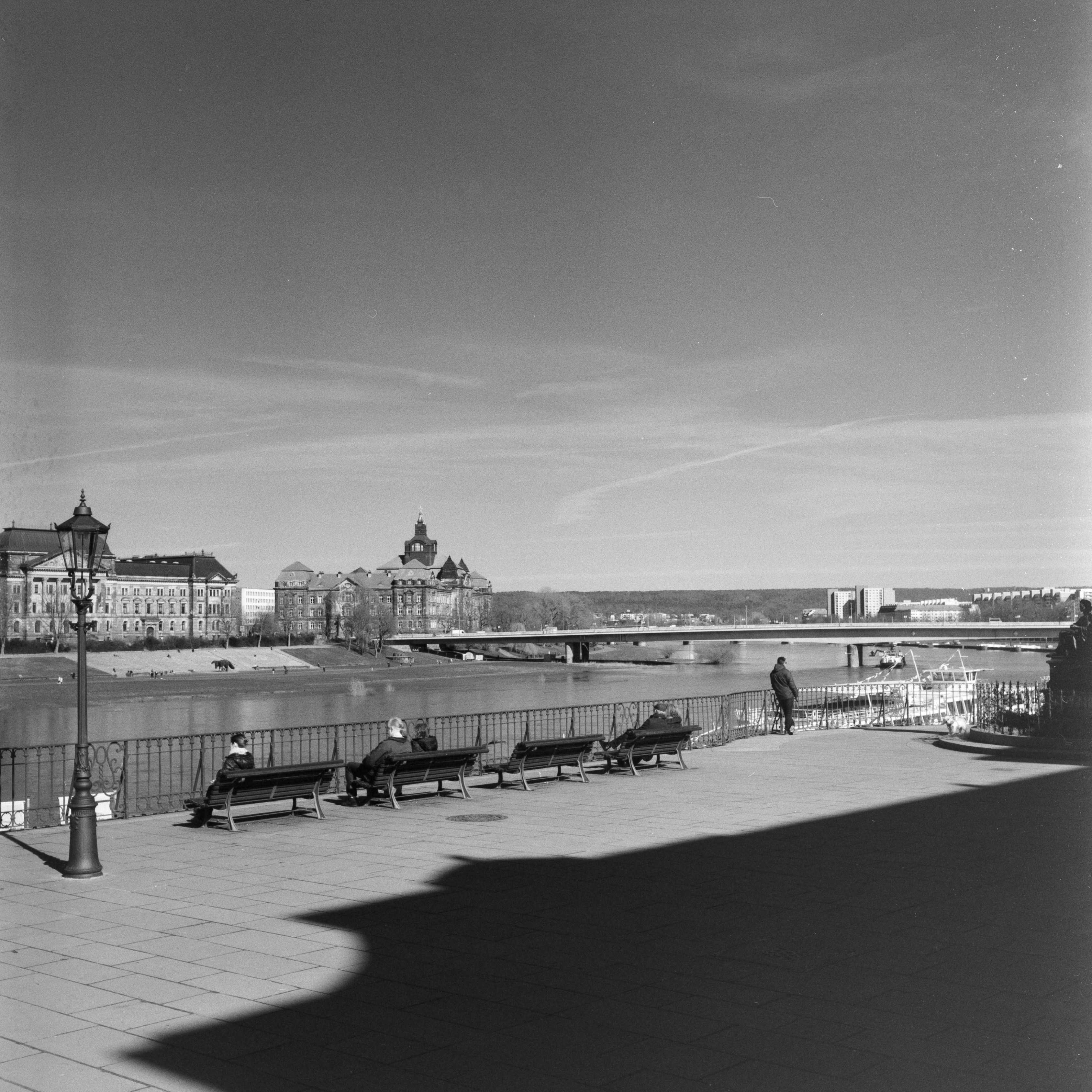 a black and white photo of a bridge over a river