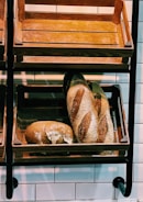 A local bakery with fresh bread displayed on shelves.