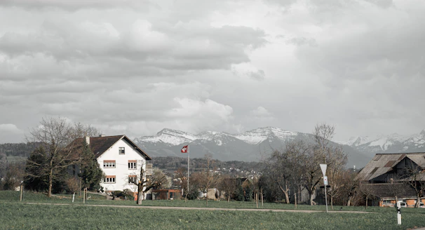 Exterior wall of a Swiss house after plastering and painting, blending perfectly with the alpine environment.