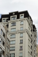 A modern residential building in London with classic architectural details.