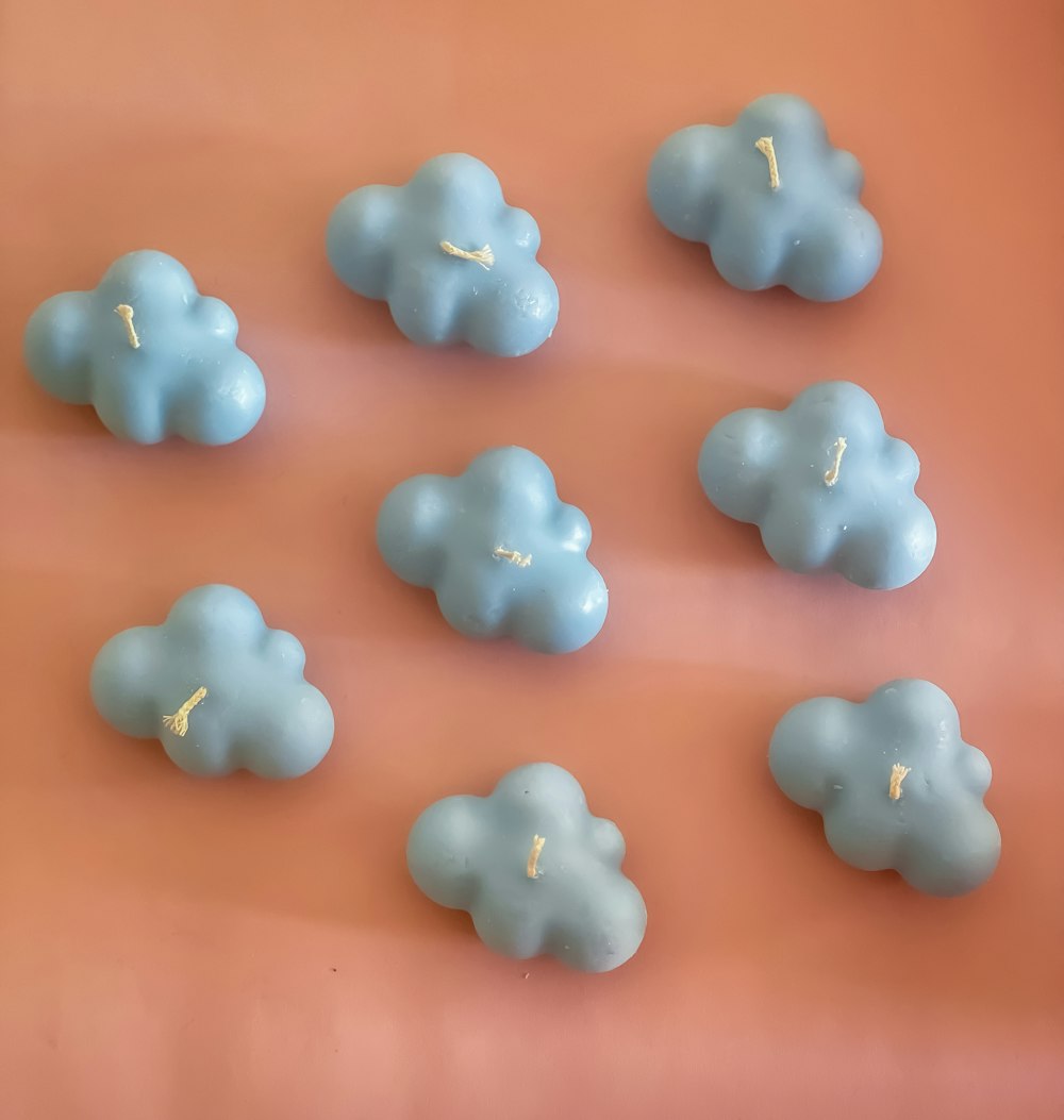 a group of blue clouds sitting on top of a table