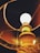 An upward view of a lit lamp with a glowing bulb. The lamp has a decorative base and is encased in a fabric lampshade that casts a warm, amber light. The interior of the lampshade is visible, highlighting its texture and color.