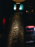 Close-up of frosty beer bottles with condensation, ready to enjoy.
