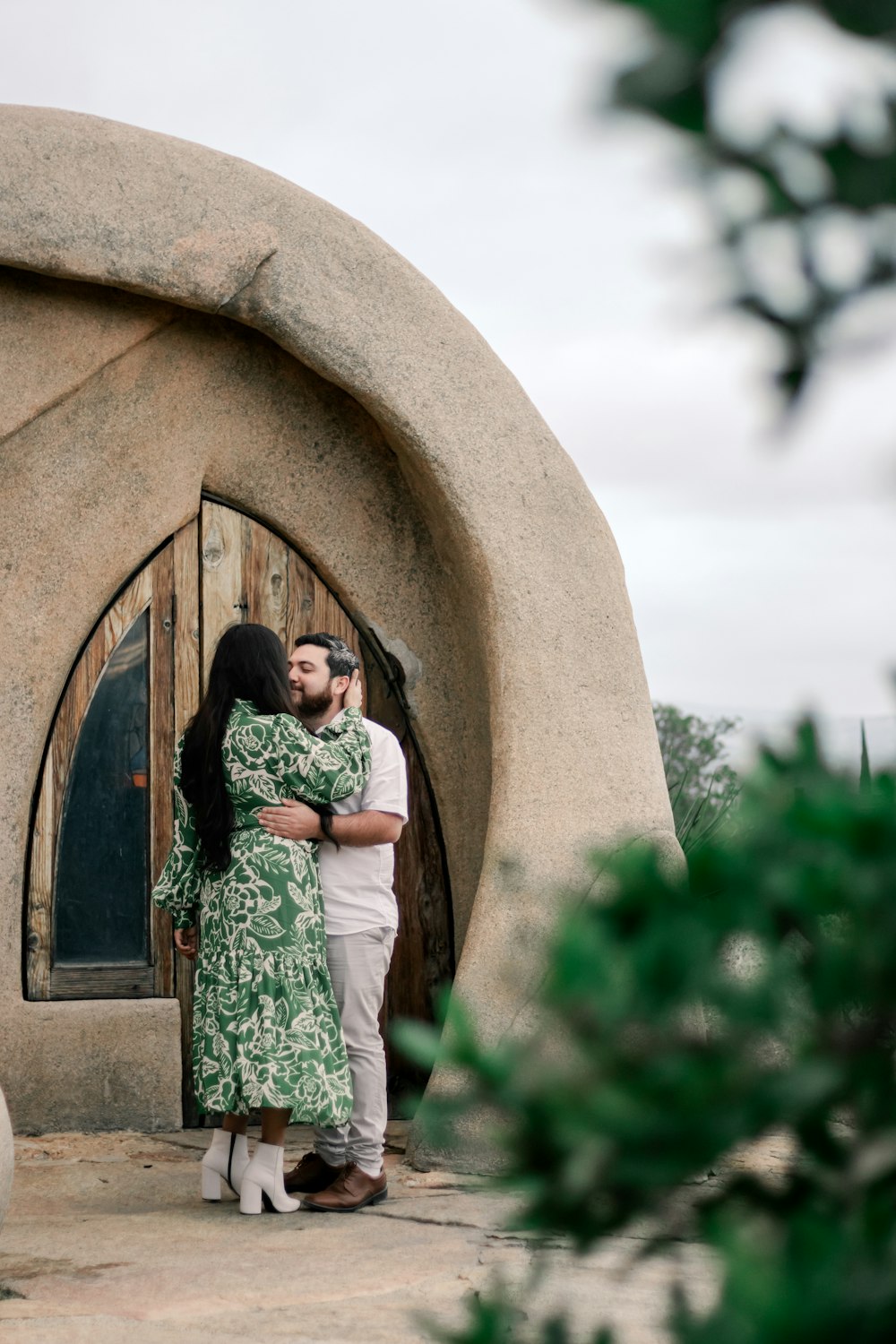 a man and a woman standing in front of a door