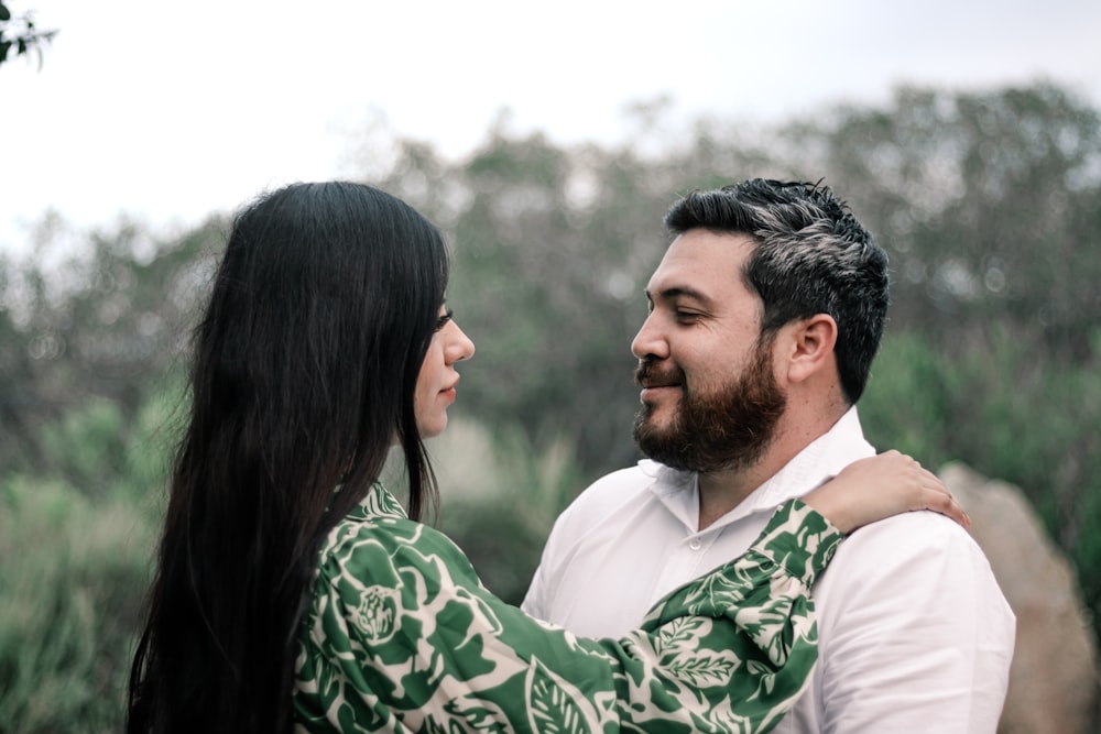 a man and a woman embracing each other