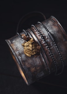 A personalized metallic silver keychain with a lion emblem, glowing softly under ambient light.