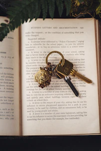 an open book with a bunch of keys on it