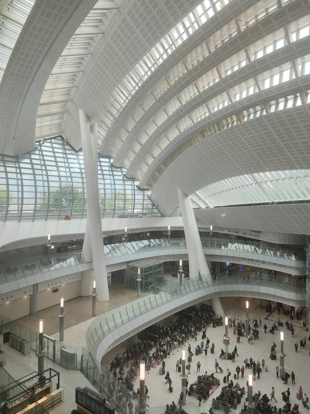 a group of people standing in a large building