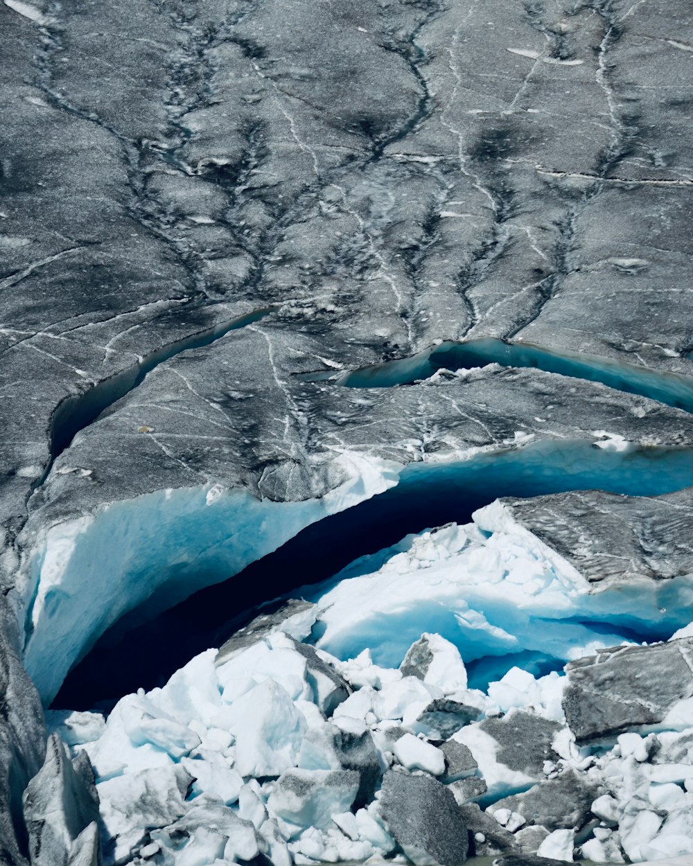 an aerial view of a glacier and a river