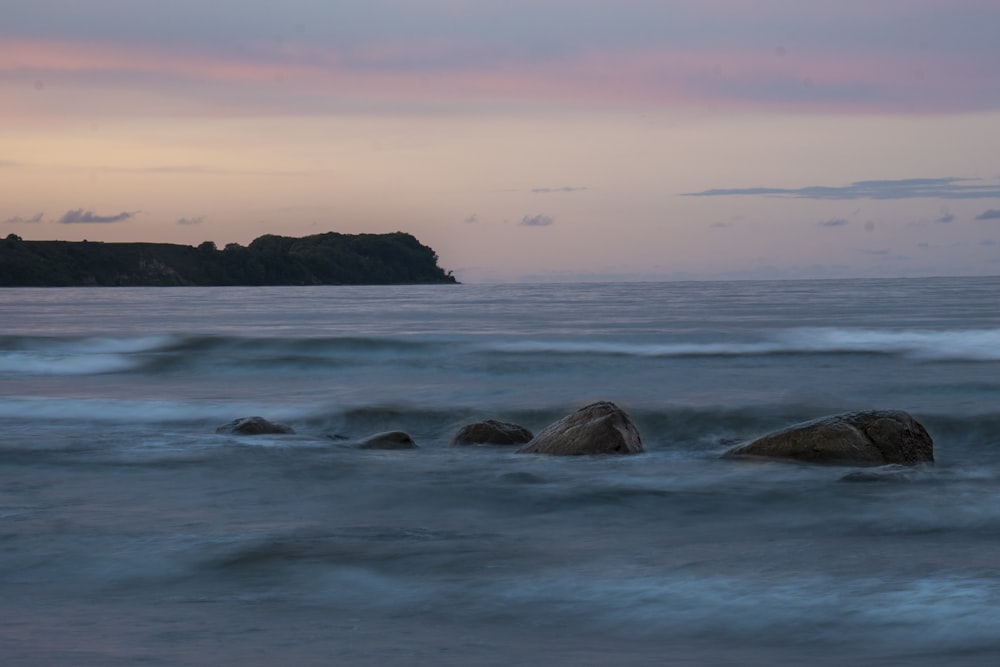 a body of water with rocks in it