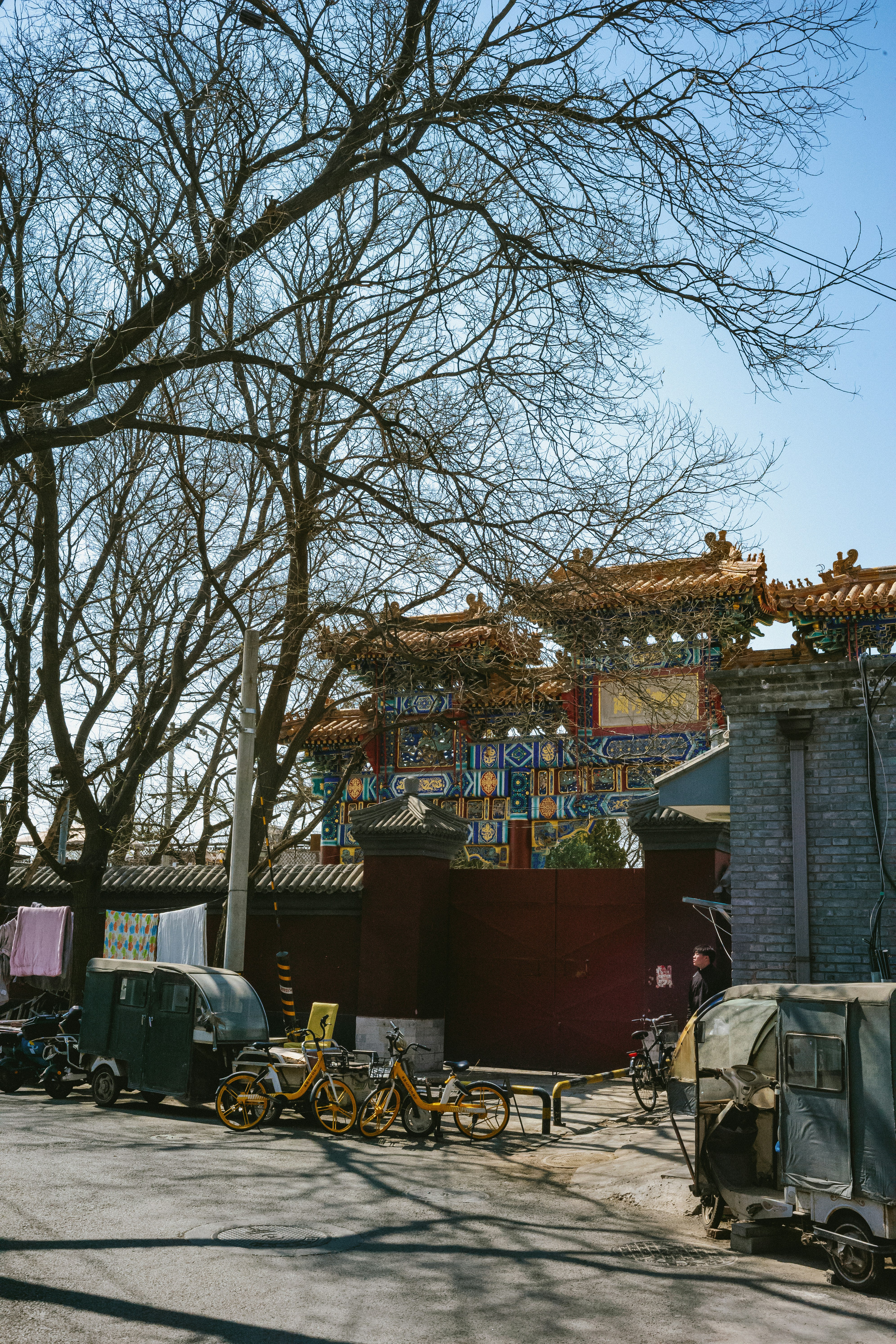 a group of bikes parked next to a building