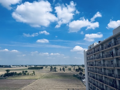 Wide shot of the property showing open space and blue sky.