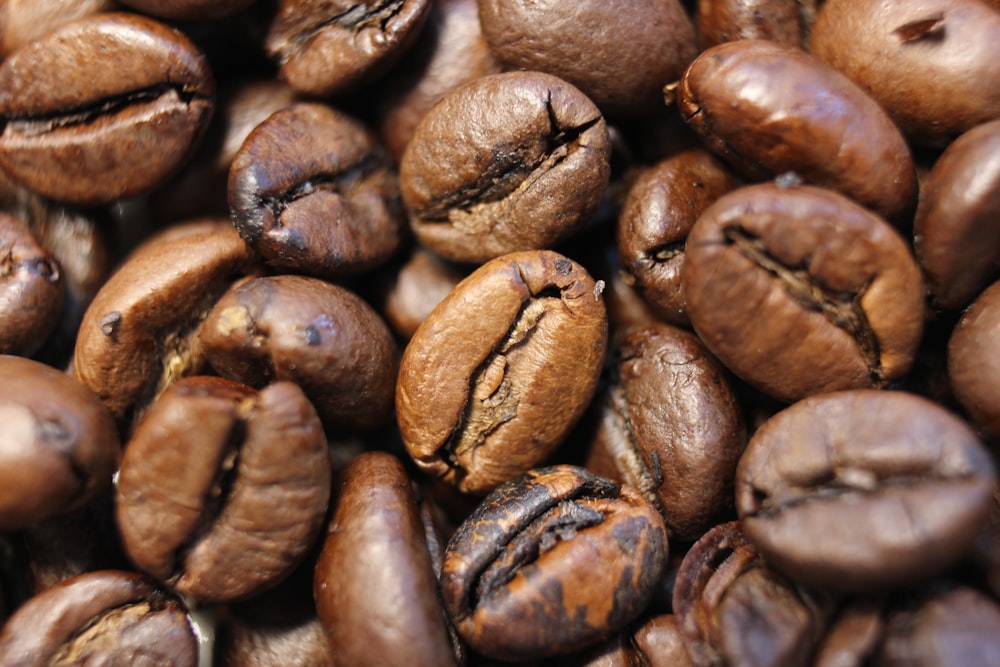 a pile of coffee beans that are brown