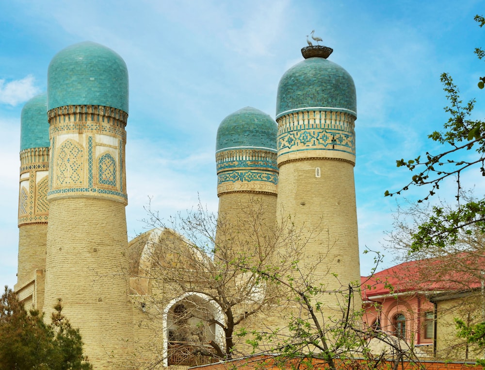 a large building with two blue domes on top of it