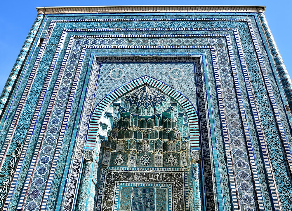 a tall building with a blue and white design on it