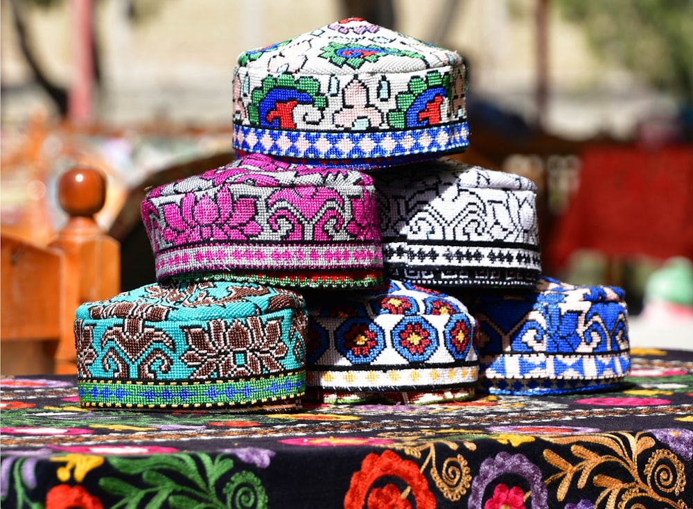 a group of colorful hats sitting on top of a table