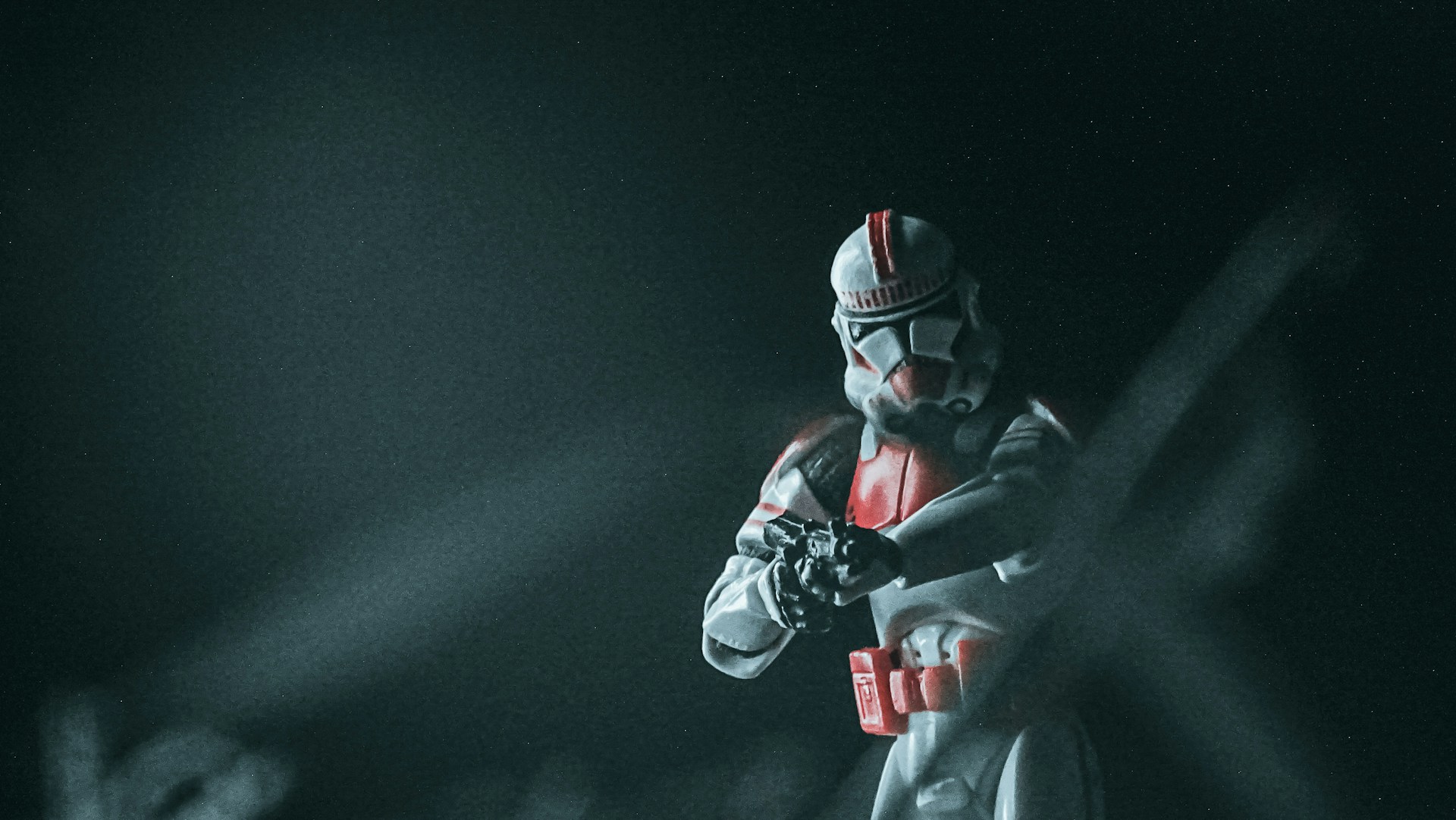 Dynamic photo of Skeletor figure mid-battle stance with swirling mist and moody lighting.