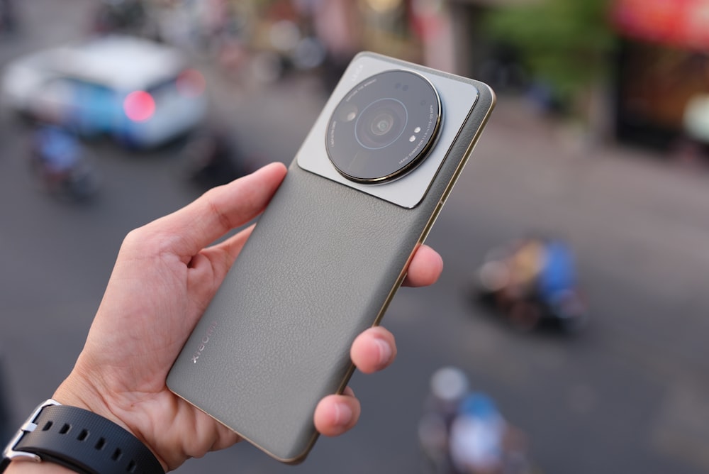 a person holding a camera in their hand