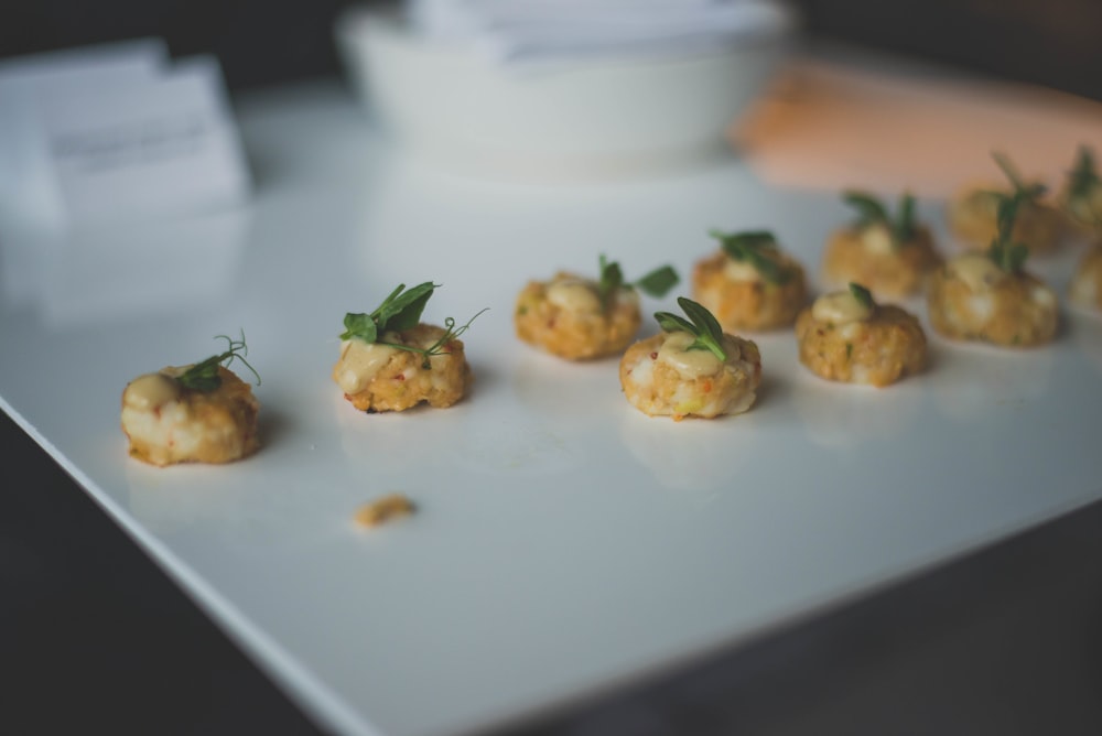 small appetizers are arranged on a white plate