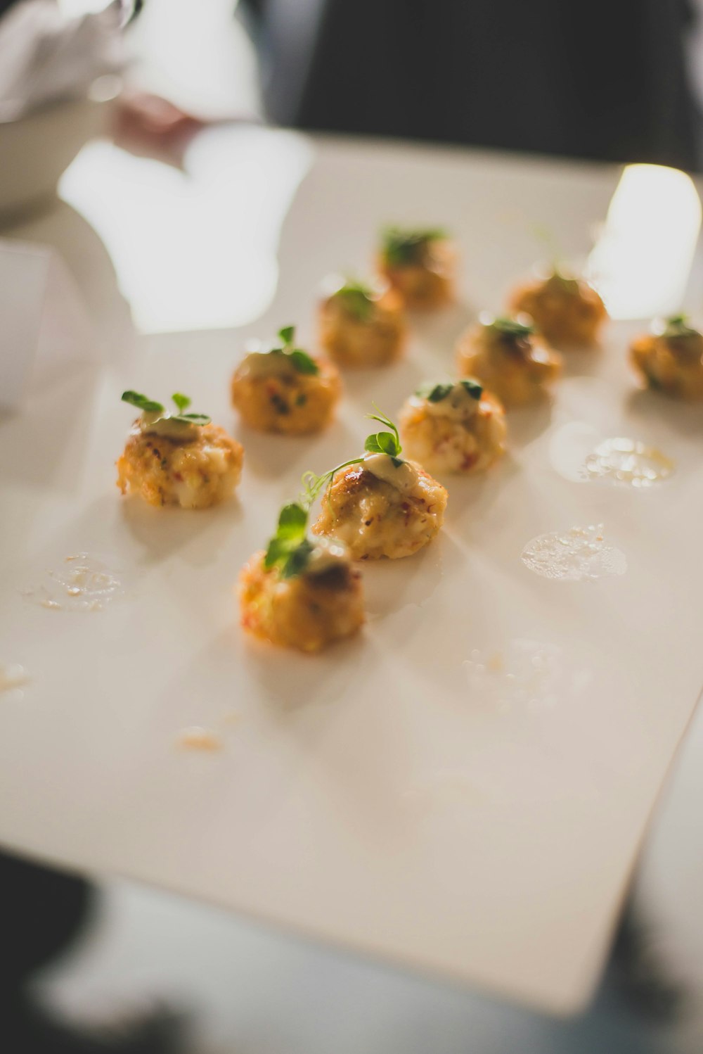 small appetizers are arranged on a white plate