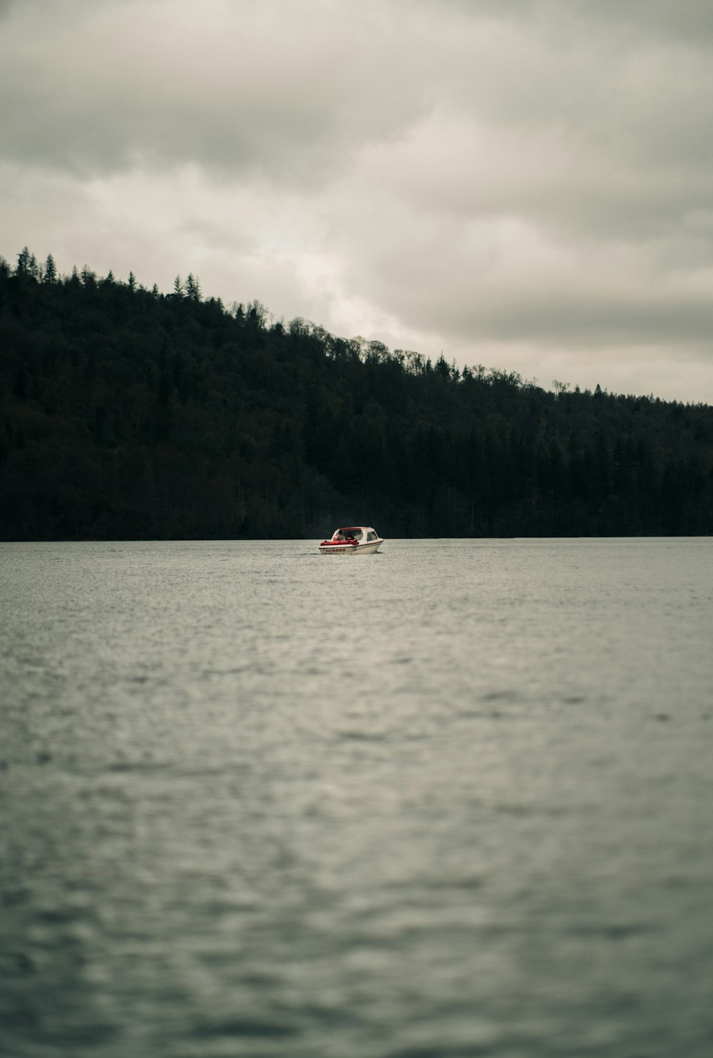 a boat floating on top of a large body of water