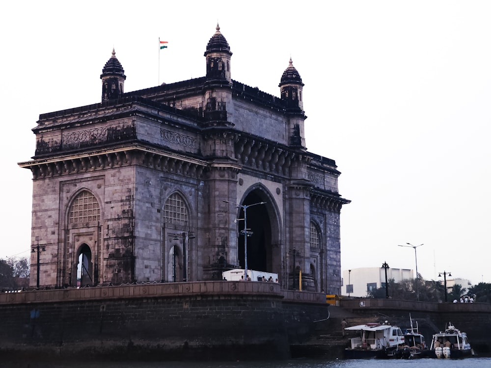 a large building sitting next to a body of water