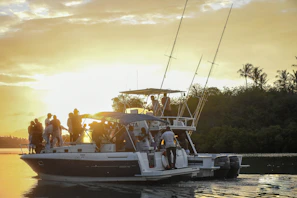 A joyful family enjoying a sunset cruise on a luxury yacht, with golden light reflecting on the water.