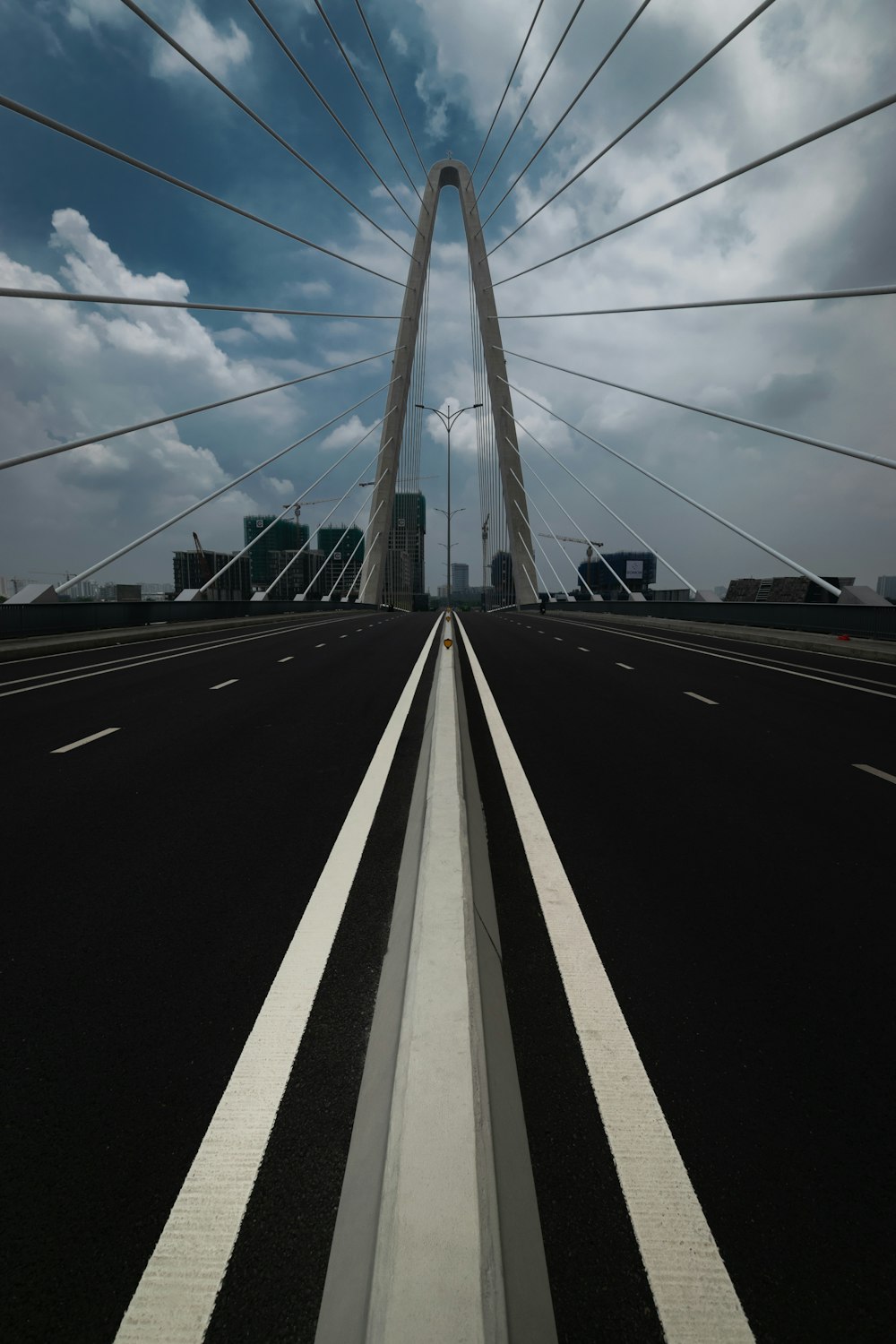 a view of a very tall bridge with a sky background