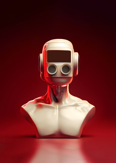 A futuristic sculpture of a humanoid bust with a smooth metallic finish. The head is designed like a retro robot with a rectangular visor and twin circular eyes, set against an intense red gradient background.