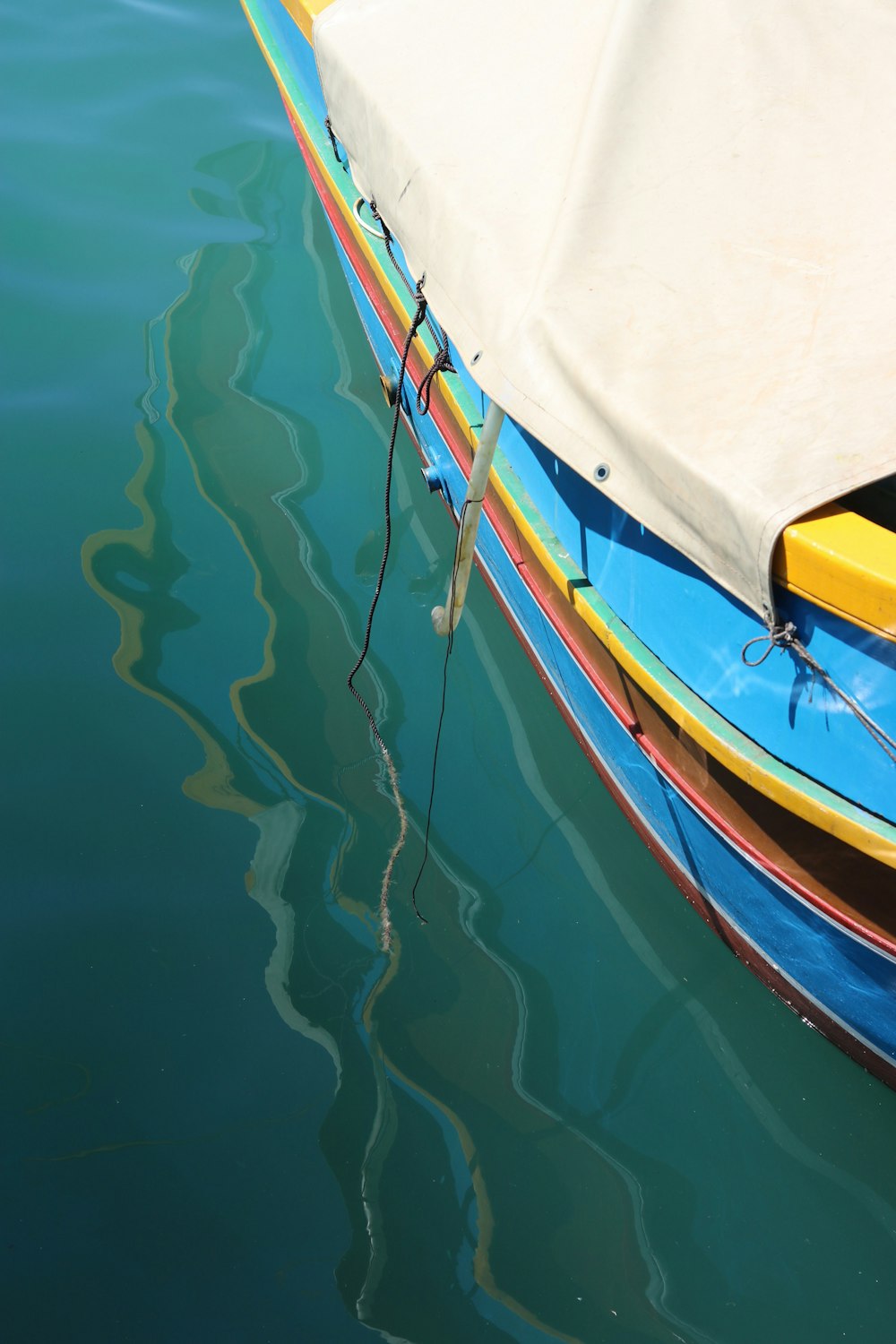 a group of boats floating on top of a body of water