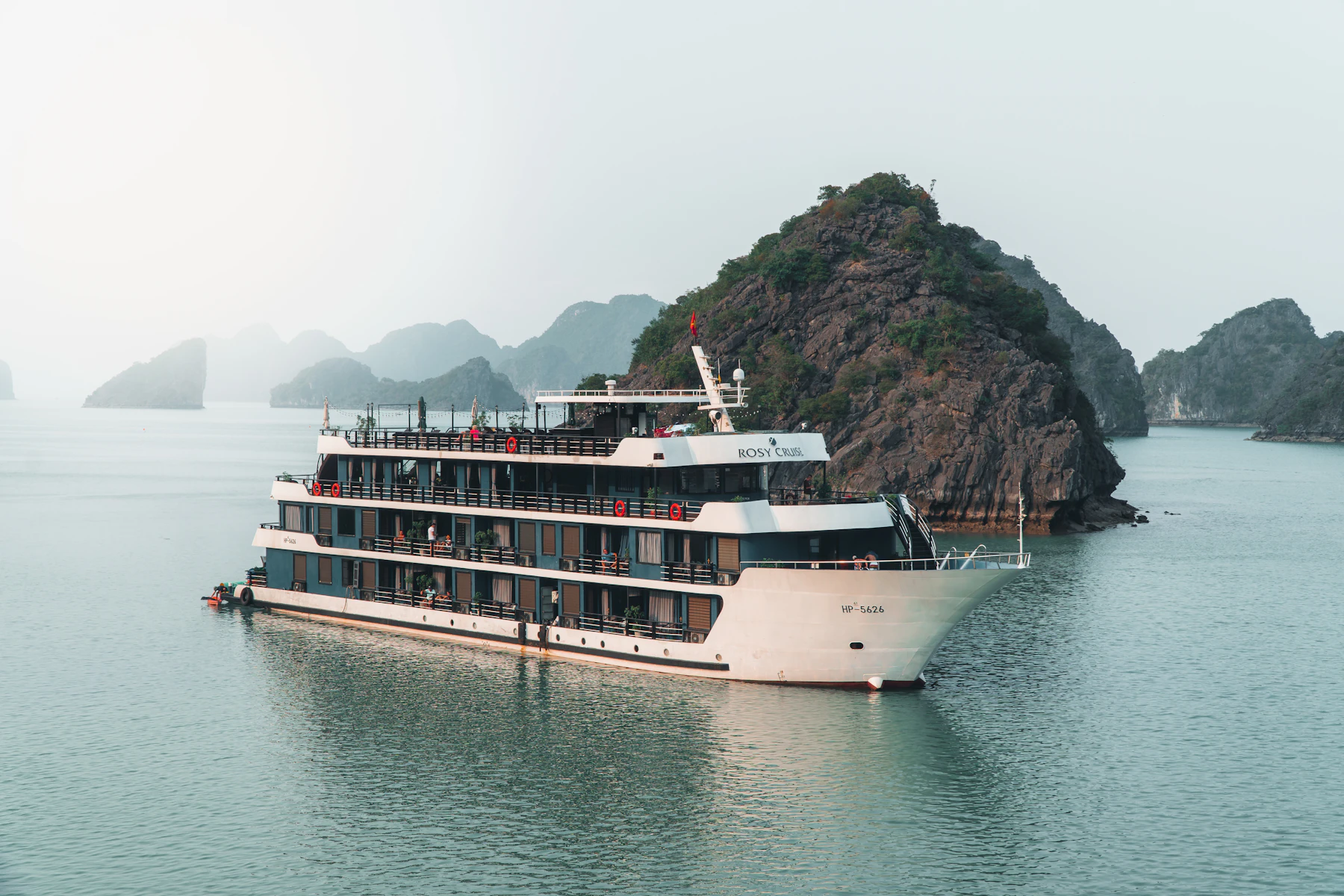 Cruise boat travelling through Ha Long Bay in Vietnam