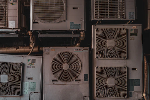 a bunch of air conditioners stacked on top of each other