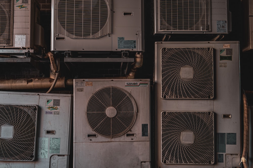 a bunch of air conditioners stacked on top of each other