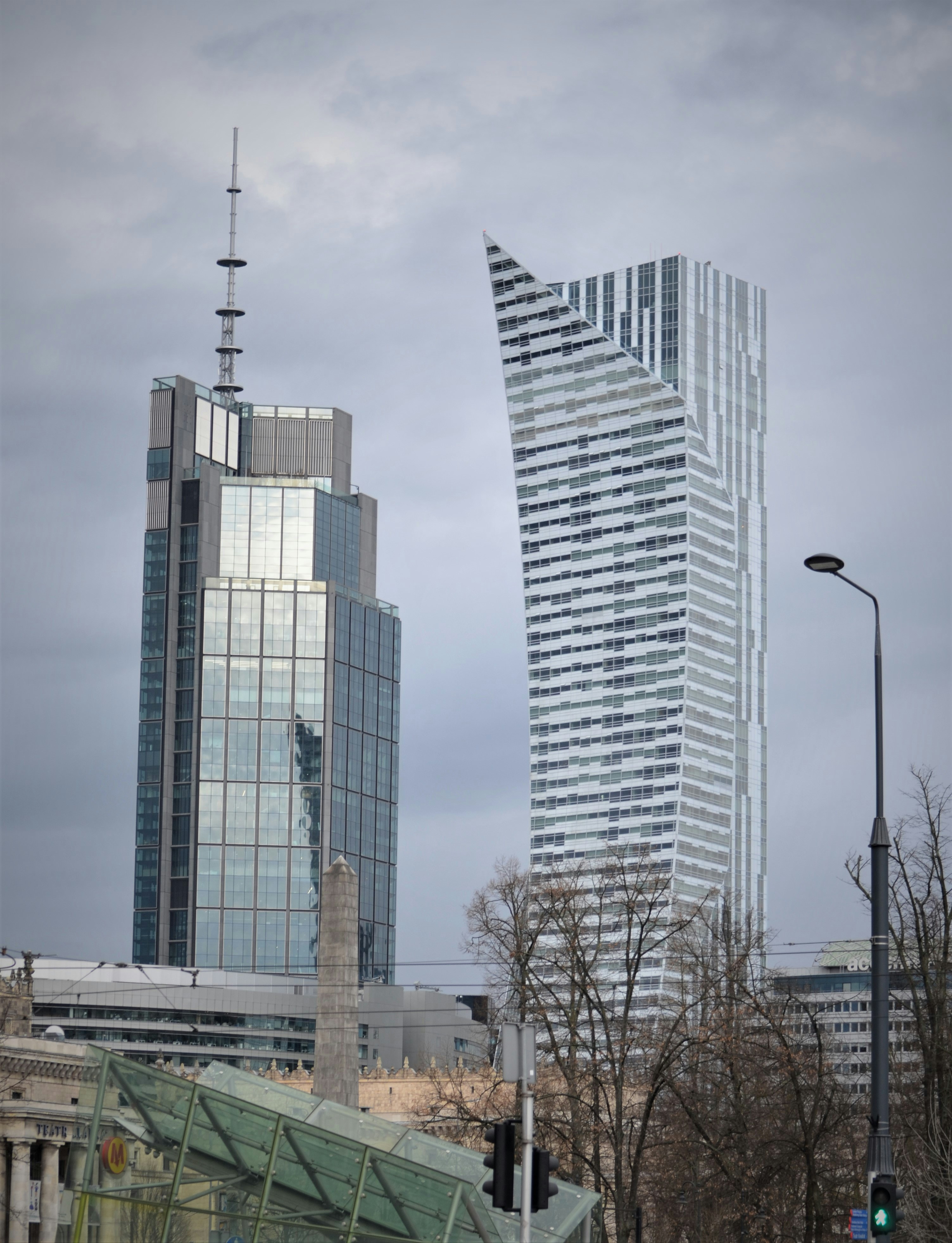 a very tall building next to a very tall building