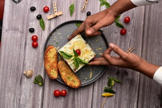 A beautifully arranged cheese platter featuring mozzarella and fresh herbs.