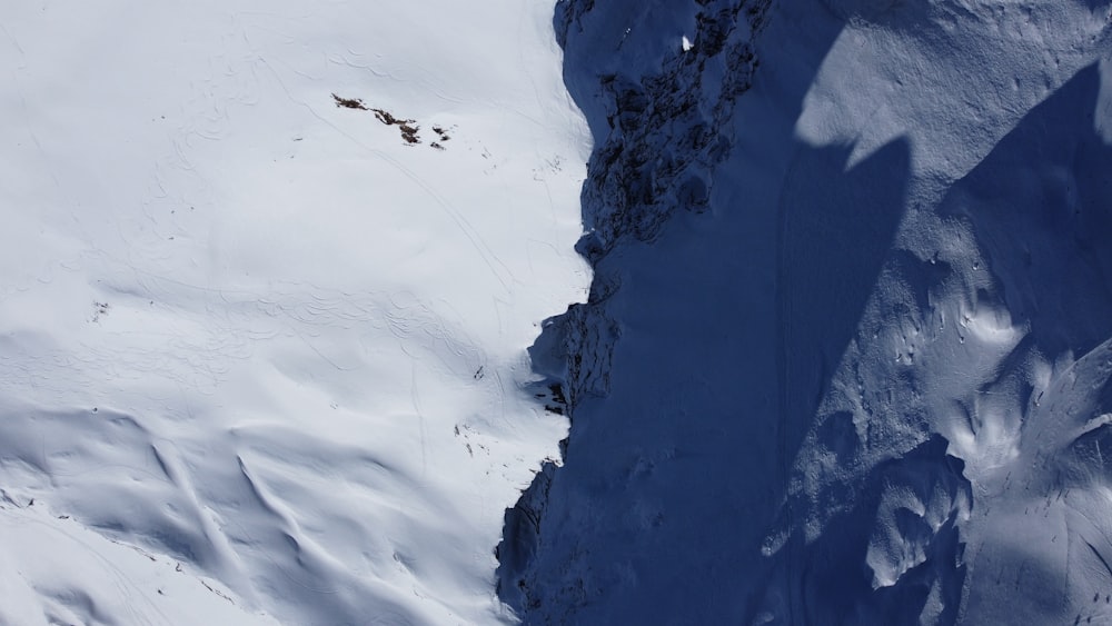 a person is skiing down a snowy mountain