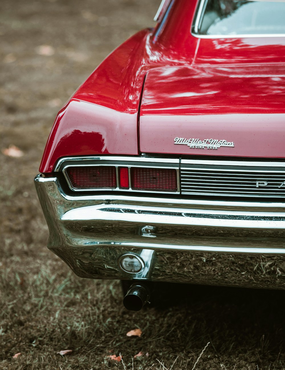 a close up of the front of a red car