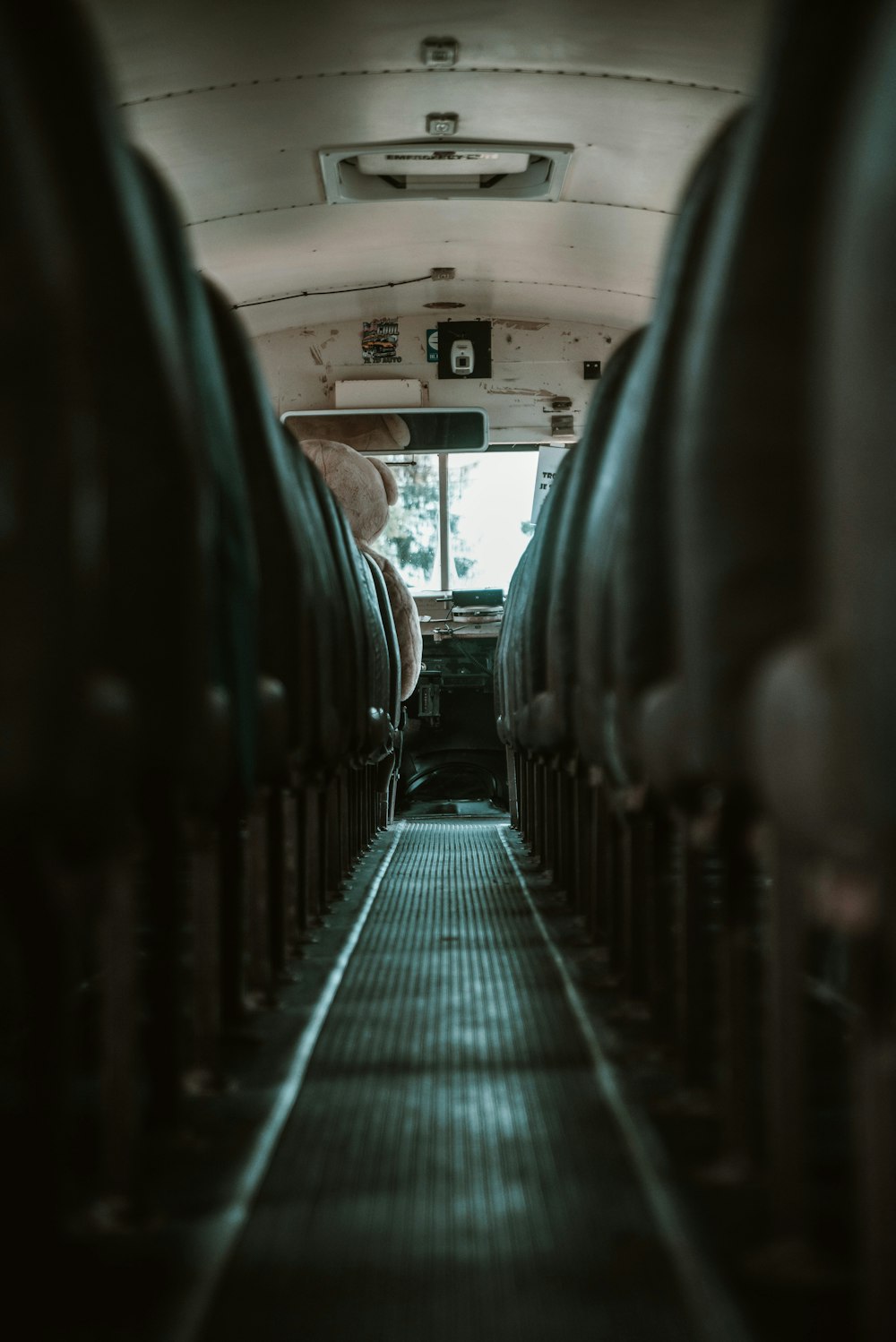 the inside of a bus with rows of seats