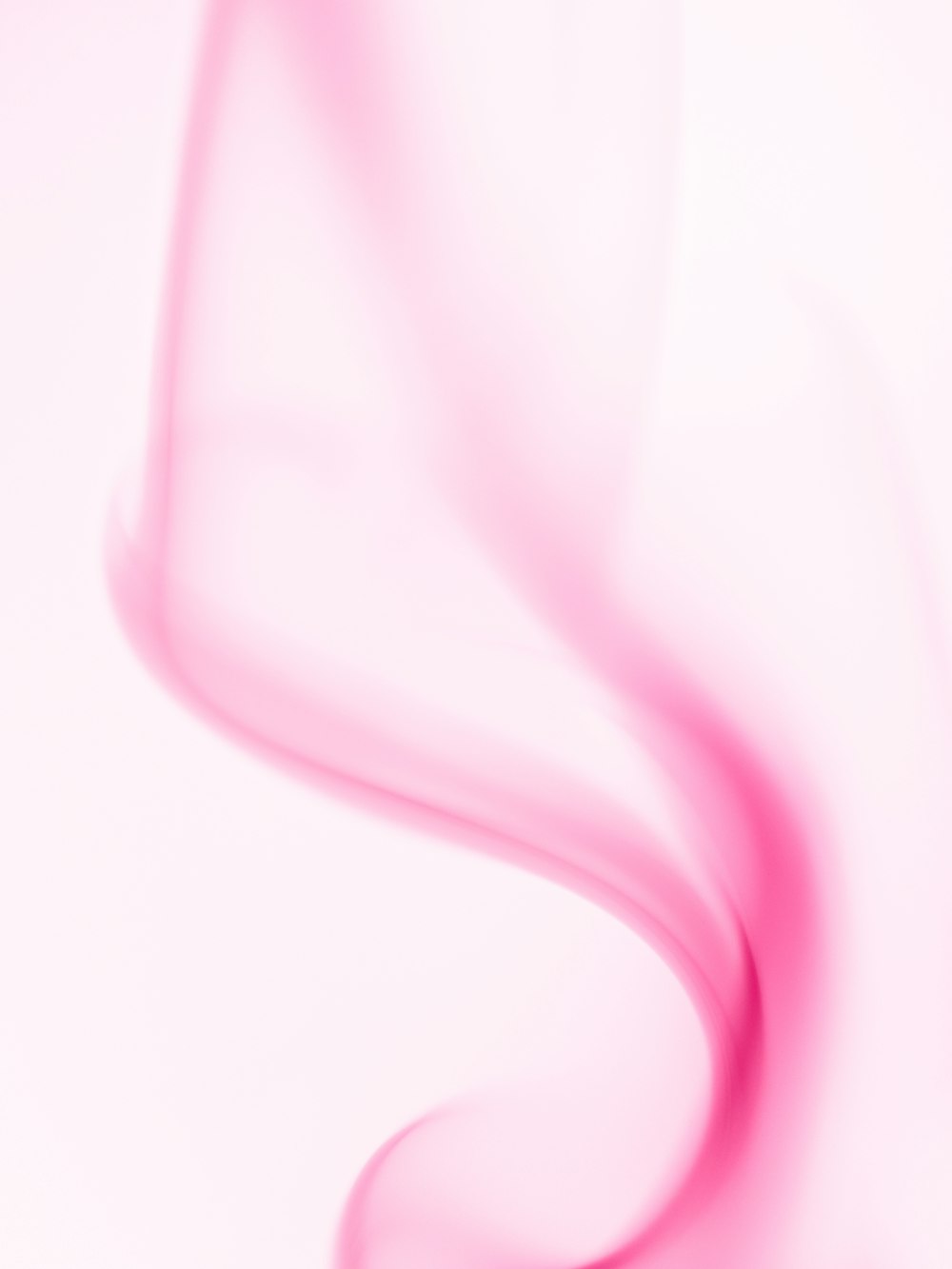 a blurry photo of a white and pink background