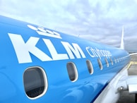 Close-up of the Eindhoven Airport Taxi logo on the side of a vehicle.